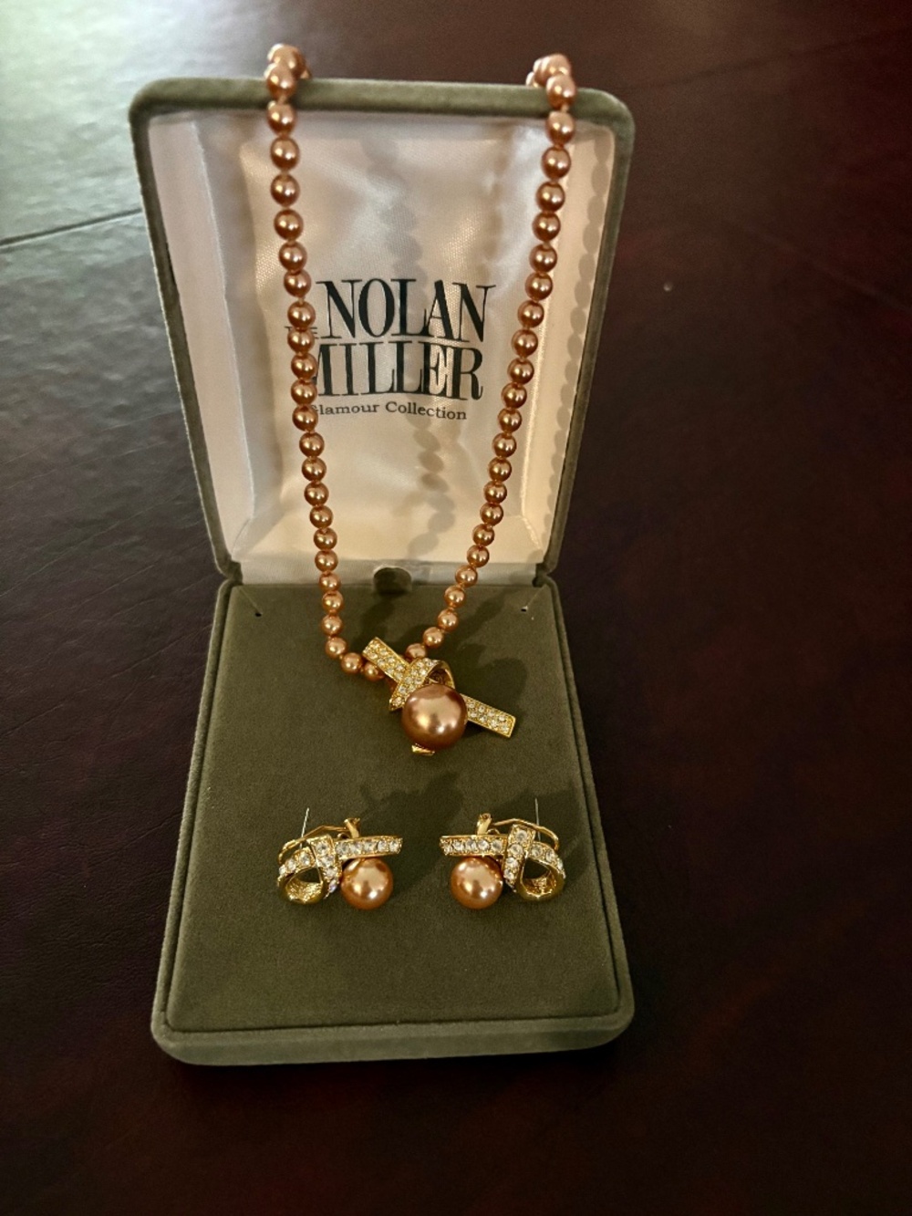 Nolan Miller Champagne color pearl necklace and earring set.